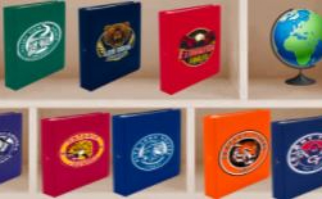 Binders with school logos in a bookcase